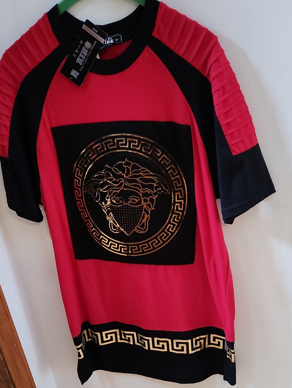 Men's Red and Black Graphic Tee with Gold Medallion